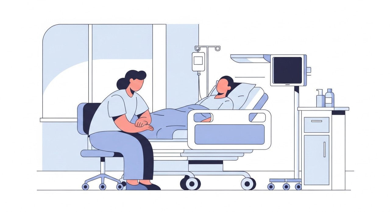 Masa Melawat Tunku Abdul Rahman University Hospital 2026 1 Seorang pelawat sedang duduk di sisi katil sambil berbual dengan pesakit di dalam wad hospital.