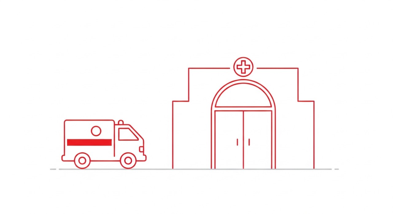 Ambulans berwarna merah dan putih diletakkan di hadapan pintu unit kecemasan hospital.