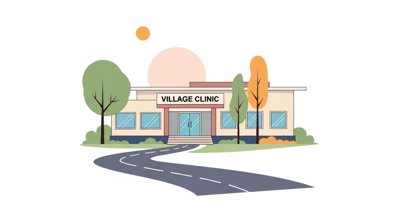 Bangunan hadapan Klinik Desa dengan bumbung merah dan tingkap besar.