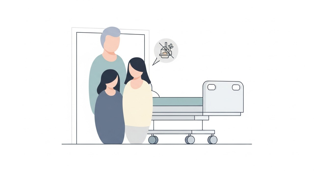 Dua ikon orang dewasa berdiri diam di hadapan katil hospital, melambangkan etika dan peraturan lawatan.