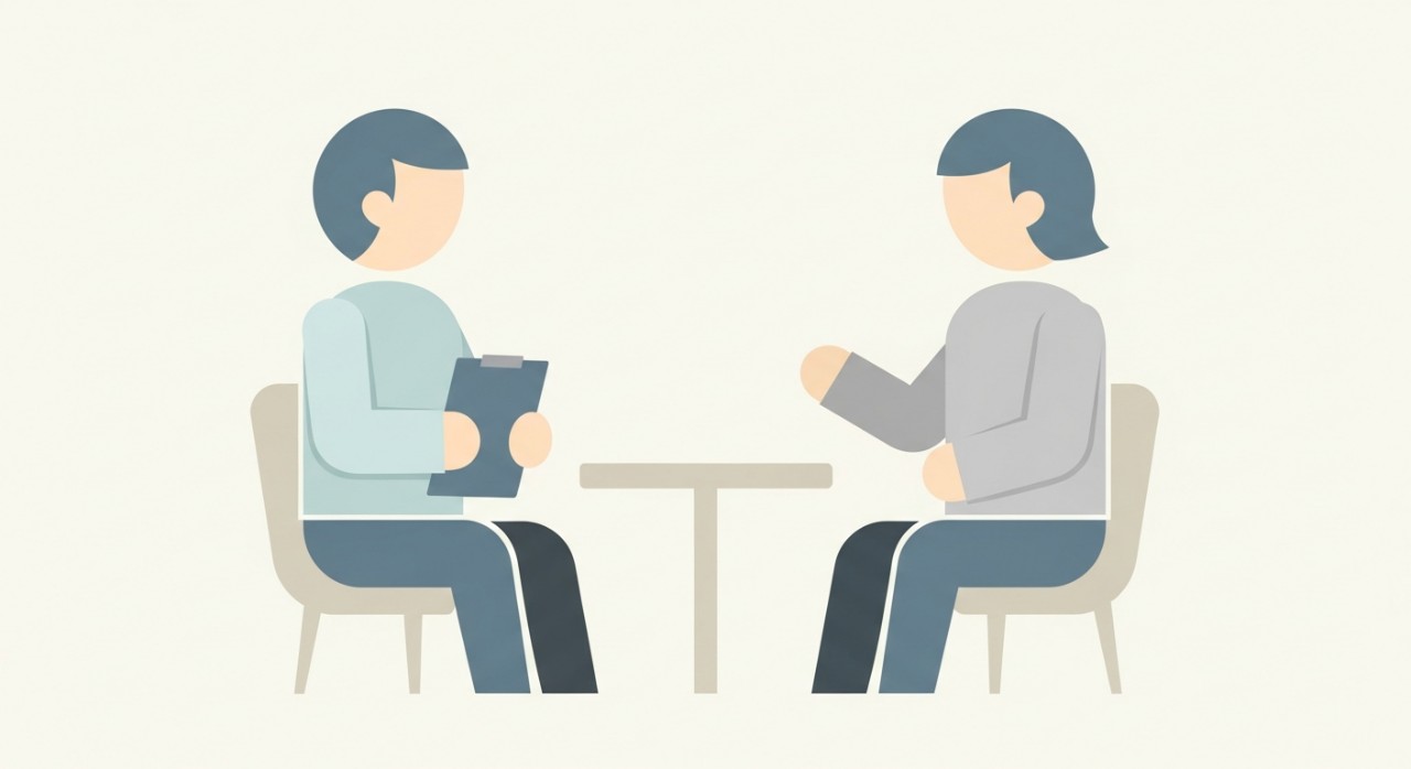 Dua figura duduk bertentangan, melambangkan sesi perbualan atau perundingan.