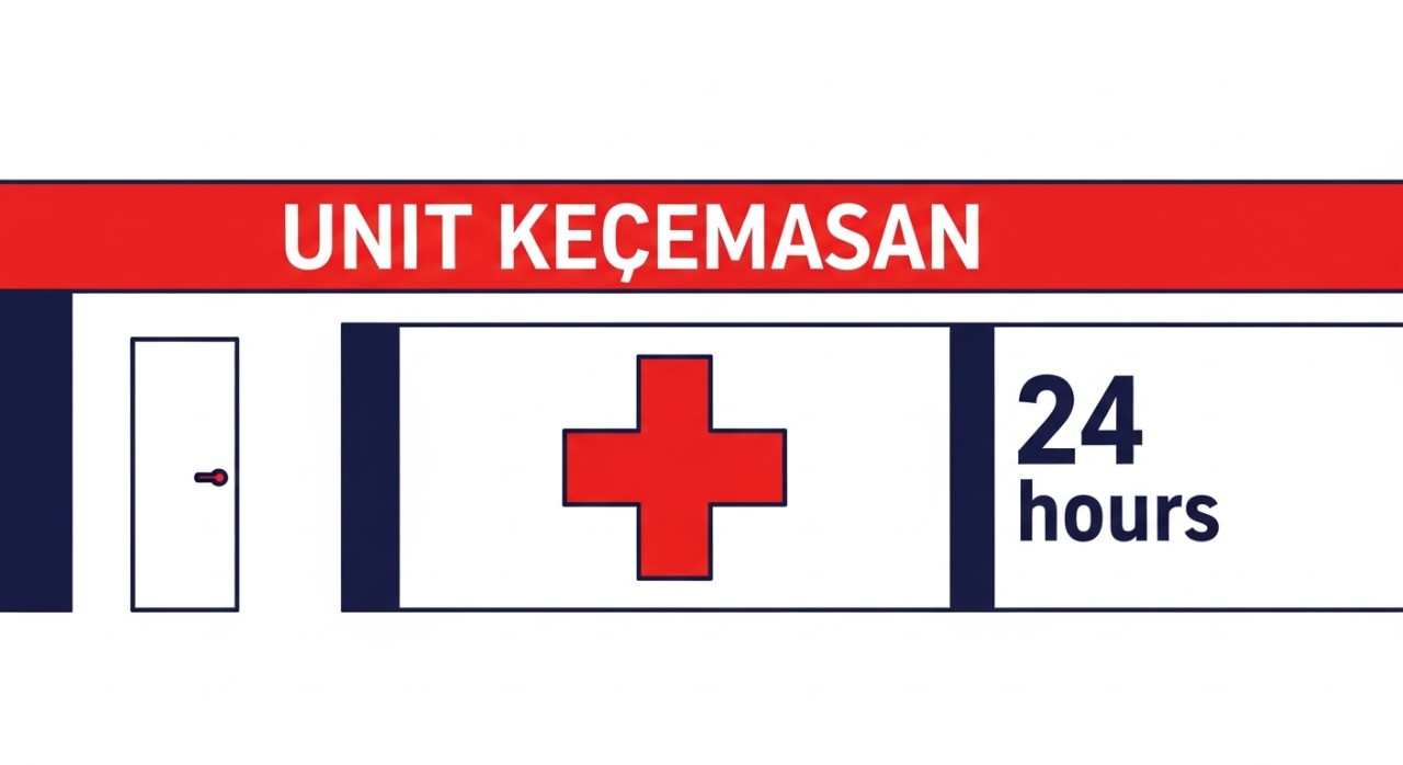 Simbol palang merah dan lampu isyarat di pintu masuk Unit Kecemasan hospital.