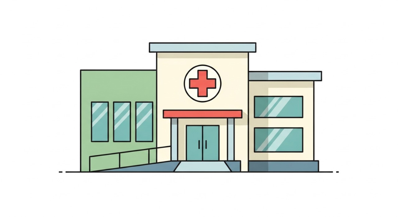 Bangunan klinik moden dengan lambang palang merah yang jelas di hadapan.
